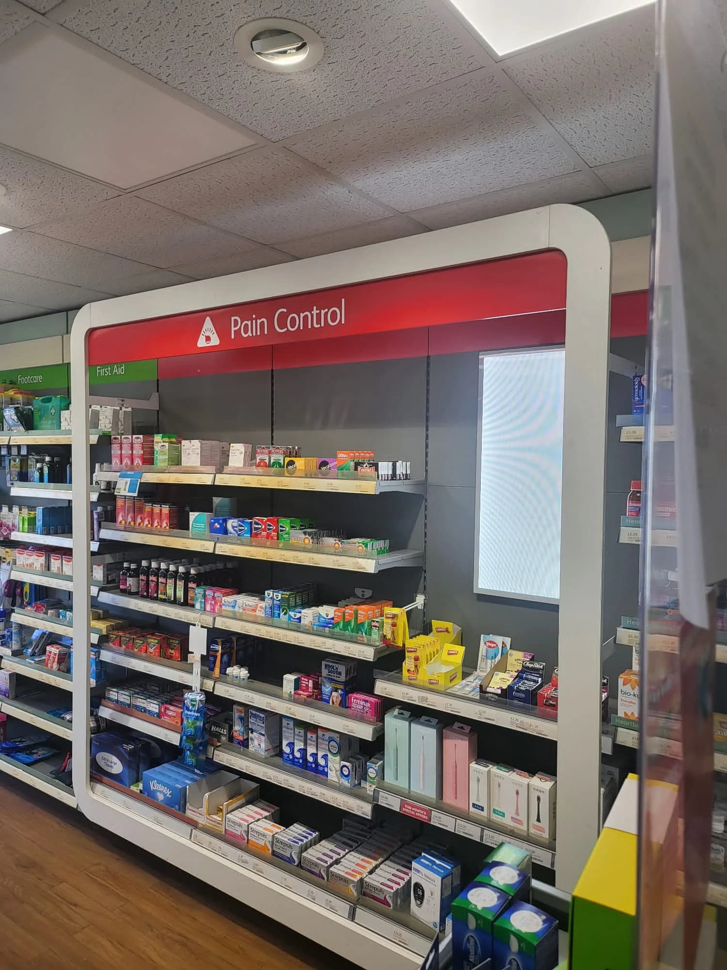 Pharmacist talking with a customer at Midsomer Pharmacy